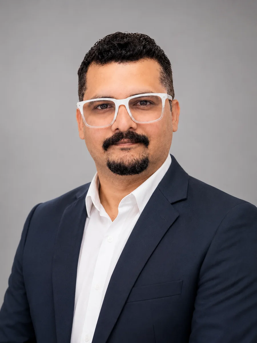Dr. Salman Ahmed Khatani, Pakistani futurist and scholar of Futures Studies and Foresight, wearing a navy suit and white shirt